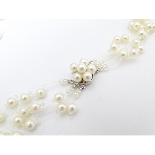 701 - Five various pearl necklaces, to include examples with silver clasps/ (5)