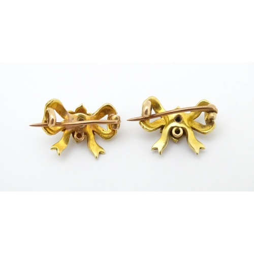 702 - Two Victorian yellow metal brooches of bow form set with seed pearls. Approx 3/4