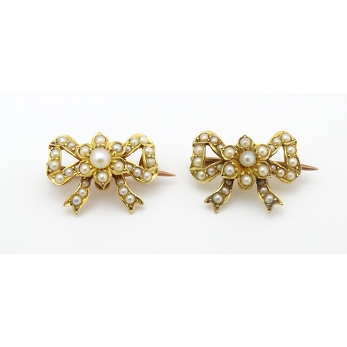 702 - Two Victorian yellow metal brooches of bow form set with seed pearls. Approx 3/4