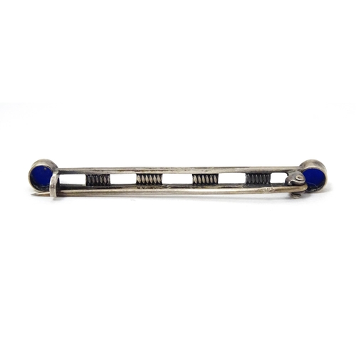 705 - A .835 silver bar brooch set with blue stone cabochon. Approx 2