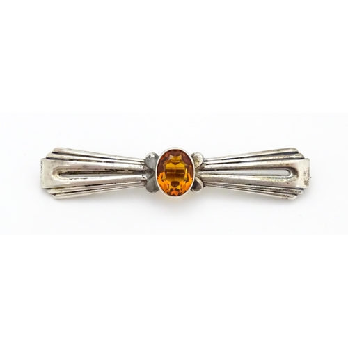 711 - A Continental .835 silver brooch set with central citrine. Indistinctly marked. 2 1/2