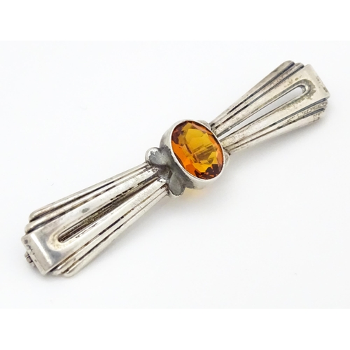 711 - A Continental .835 silver brooch set with central citrine. Indistinctly marked. 2 1/2