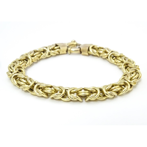 724 - Three assorted silver bracelets to include two silver gilt examples and a bangle formed bracelet (3)