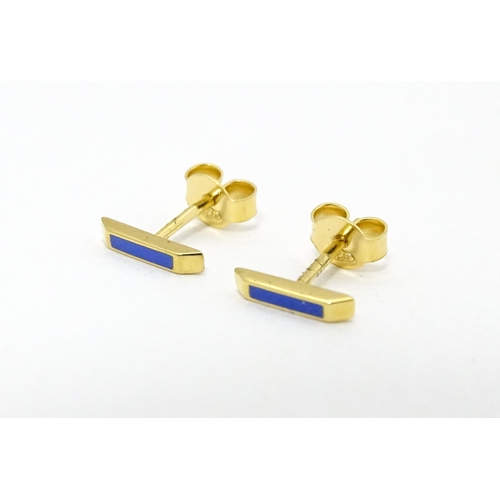 732 - A pair of Astley Clarke 925 silver gilt stud earrings with blue enamel detail. Approx. 1/4