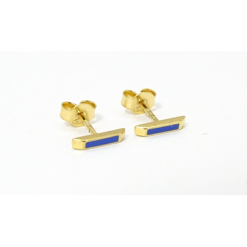 732 - A pair of Astley Clarke 925 silver gilt stud earrings with blue enamel detail. Approx. 1/4