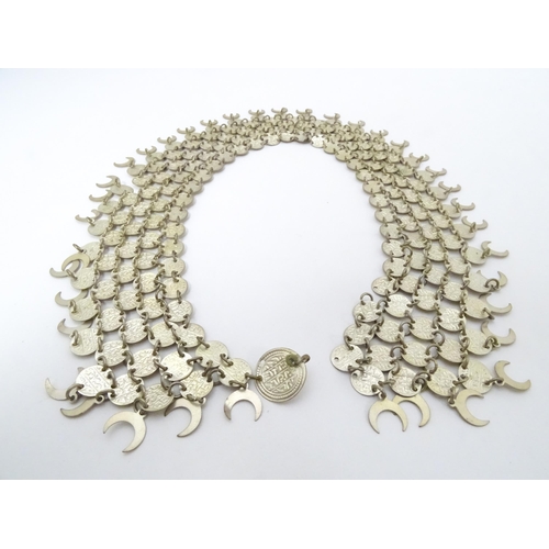 734 - A Persian / Indian style white metal necklace / chocker collar formed of discs with script and cresc... 