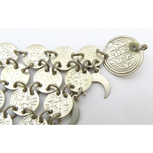 734 - A Persian / Indian style white metal necklace / chocker collar formed of discs with script and cresc... 