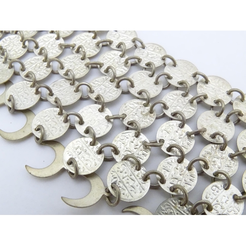 734 - A Persian / Indian style white metal necklace / chocker collar formed of discs with script and cresc... 