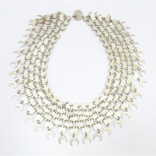 734 - A Persian / Indian style white metal necklace / chocker collar formed of discs with script and cresc... 