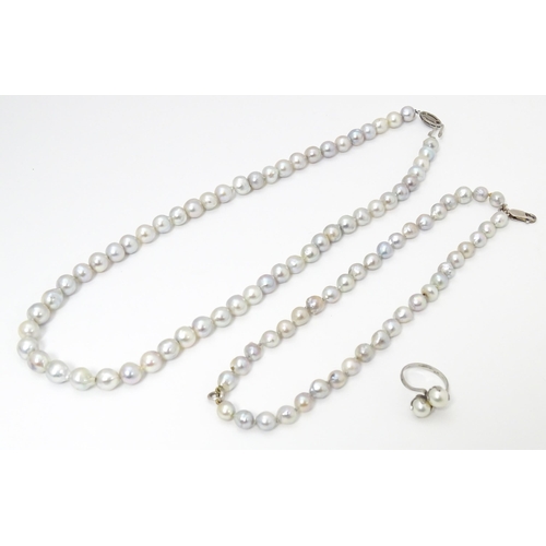 737 - Pearl jewellery comprising a two strand bracelet with silver clasp, a necklace with silver clasp and... 