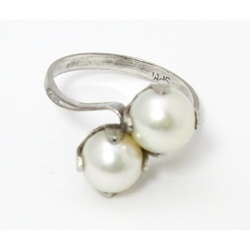 737 - Pearl jewellery comprising a two strand bracelet with silver clasp, a necklace with silver clasp and... 