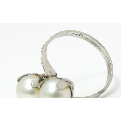 737 - Pearl jewellery comprising a two strand bracelet with silver clasp, a necklace with silver clasp and... 