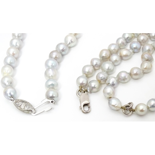 737 - Pearl jewellery comprising a two strand bracelet with silver clasp, a necklace with silver clasp and... 