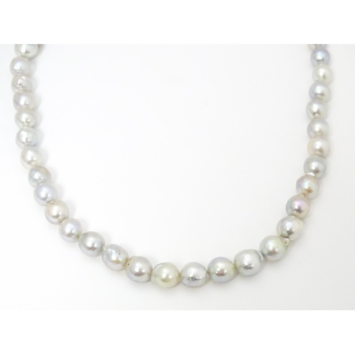 737 - Pearl jewellery comprising a two strand bracelet with silver clasp, a necklace with silver clasp and... 