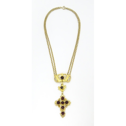 738 - A silver gilt pendant necklace of cross form with garnet coloured paste stones approx 16 1/2