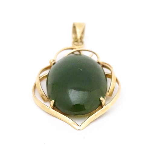 742 - A yellow metal pendant set with green stone cabochon. Together with a pair of 9ct gold pearl earring... 