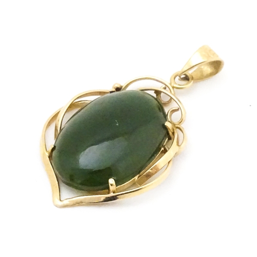 742 - A yellow metal pendant set with green stone cabochon. Together with a pair of 9ct gold pearl earring... 