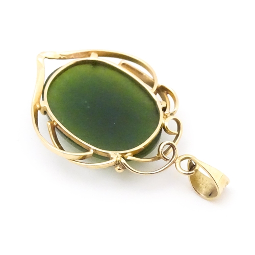 742 - A yellow metal pendant set with green stone cabochon. Together with a pair of 9ct gold pearl earring... 