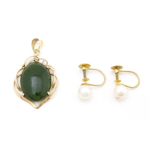 742 - A yellow metal pendant set with green stone cabochon. Together with a pair of 9ct gold pearl earring... 