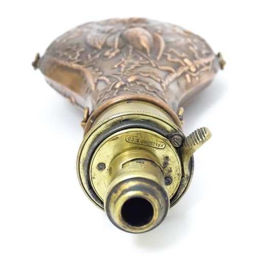 814 - A Victorian copper and brass powder flask by Handsome & Co, the spout with dram measure, the body em... 