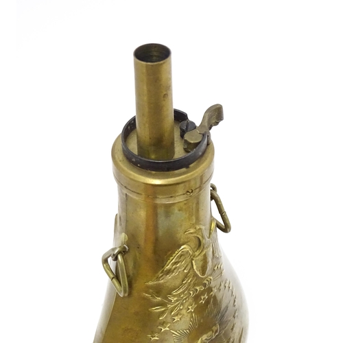 814 - A Victorian copper and brass powder flask by Handsome & Co, the spout with dram measure, the body em... 