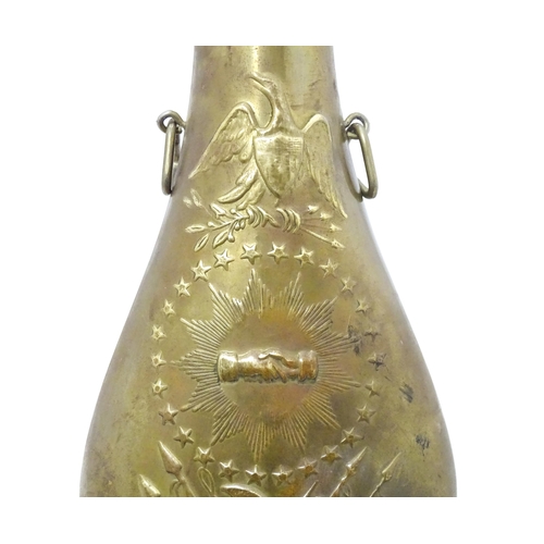 814 - A Victorian copper and brass powder flask by Handsome & Co, the spout with dram measure, the body em... 