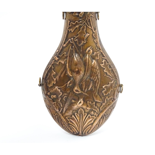 814 - A Victorian copper and brass powder flask by Handsome & Co, the spout with dram measure, the body em... 