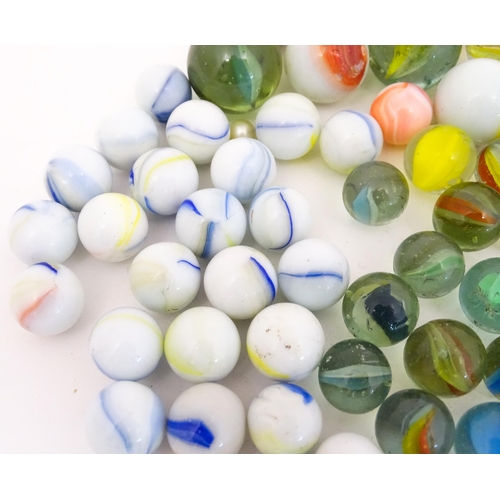 837 - Toys: A quantity of marbles, many with colours twists, etc. Largest approx. 1