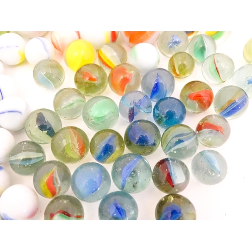 837 - Toys: A quantity of marbles, many with colours twists, etc. Largest approx. 1