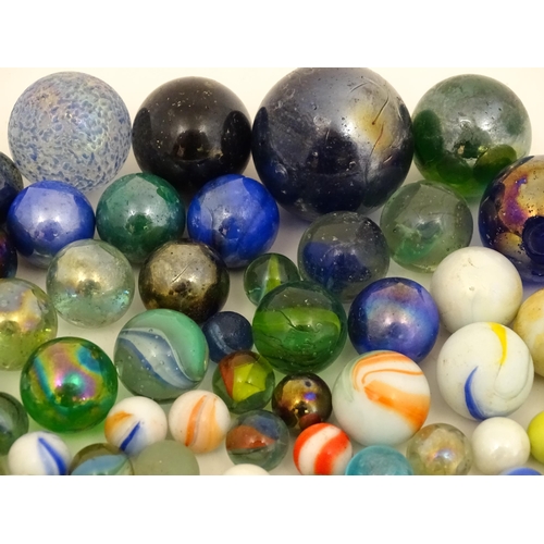 838 - Toys: A quantity of marbles, many with colours twists. Largest approx. 1 3/4