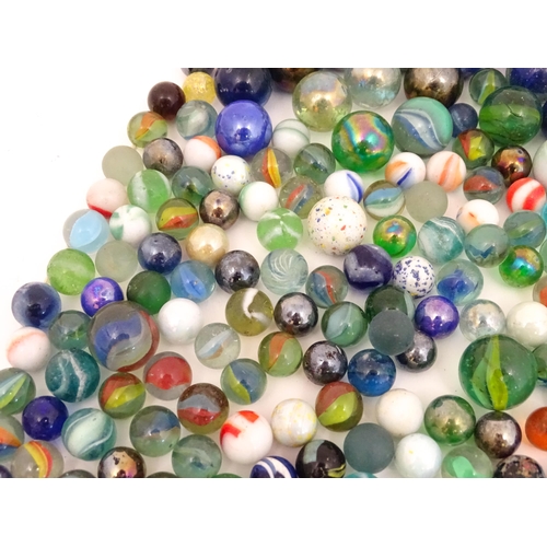 838 - Toys: A quantity of marbles, many with colours twists. Largest approx. 1 3/4