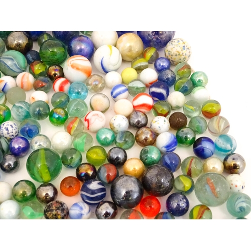 838 - Toys: A quantity of marbles, many with colours twists. Largest approx. 1 3/4