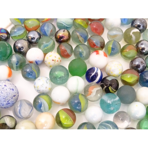 838 - Toys: A quantity of marbles, many with colours twists. Largest approx. 1 3/4