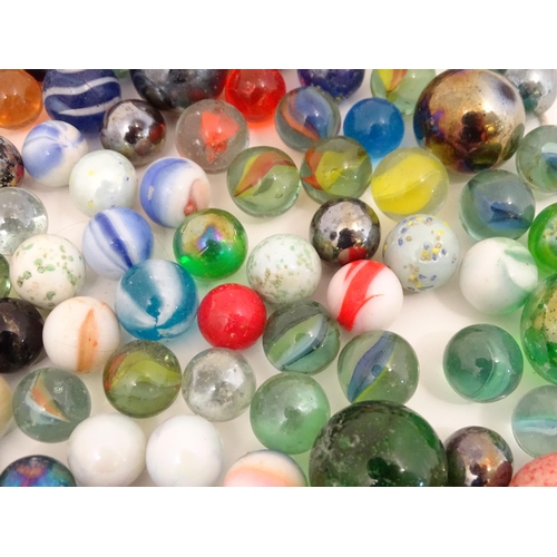 838 - Toys: A quantity of marbles, many with colours twists. Largest approx. 1 3/4