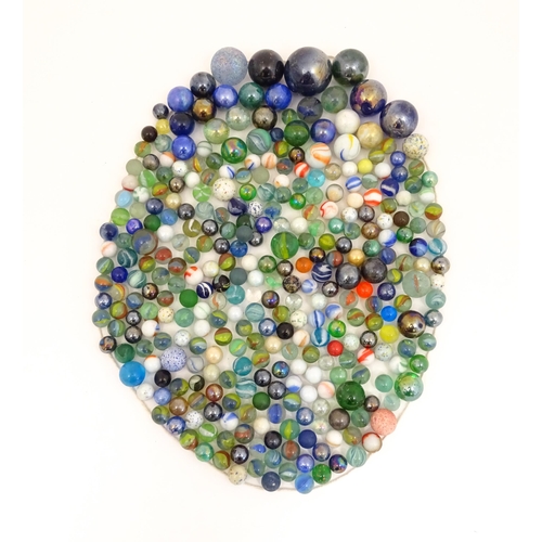 838 - Toys: A quantity of marbles, many with colours twists. Largest approx. 1 3/4