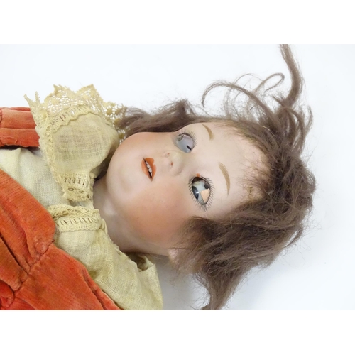 839A - Toy: A German Gebruder Heubach doll with a bisque head and composite body. Approx. 13 1/4