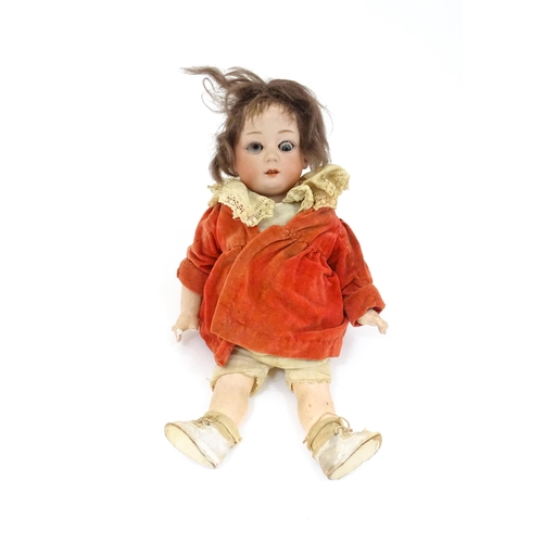 839A - Toy: A German Gebruder Heubach doll with a bisque head and composite body. Approx. 13 1/4