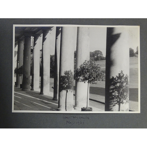 990 - An early 20thC travel photograph album depicting various British and European destinations, to inclu... 