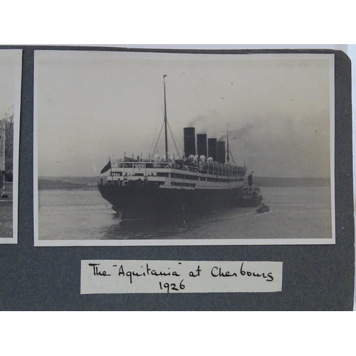 990 - An early 20thC travel photograph album depicting various British and European destinations, to inclu... 