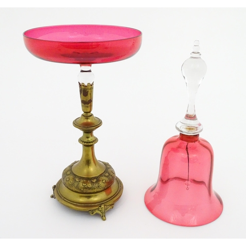 215 - A cranberry clear glass bell together with a glass tazza the base formed as an epergne / centrepiece... 