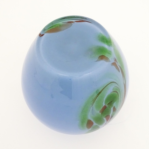 219 - A 20thC art glass vase in the Murano style, the blue body with green brown swirl detail. Approx. 10