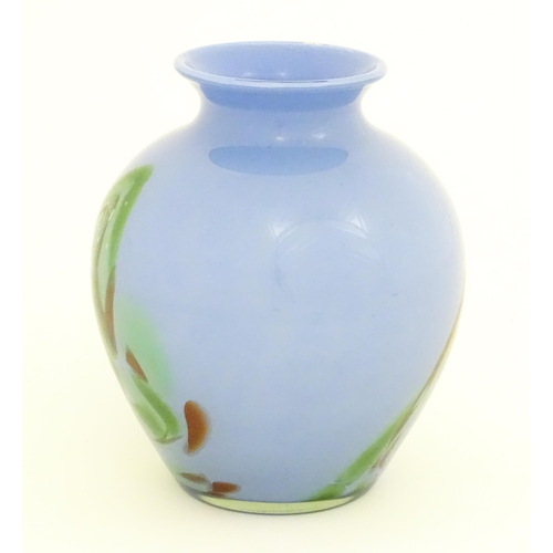 219 - A 20thC art glass vase in the Murano style, the blue body with green brown swirl detail. Approx. 10