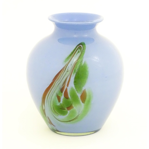 219 - A 20thC art glass vase in the Murano style, the blue body with green brown swirl detail. Approx. 10