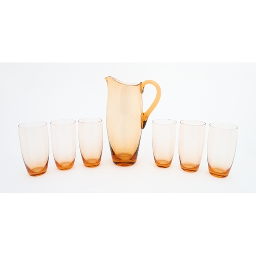 221 - A peach glass lemonade set comprising jug and six glasses. Jug approx. 9 1/2