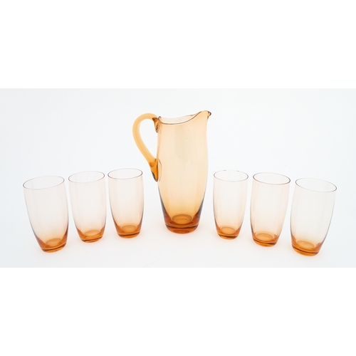 221 - A peach glass lemonade set comprising jug and six glasses. Jug approx. 9 1/2