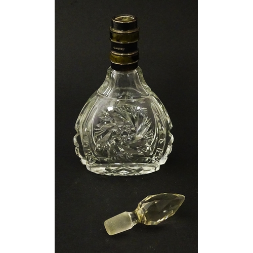 234 - A cut glass scent / perfume bottle and stopper, the silver collar with banded detail and hallmarked ... 