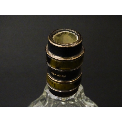 234 - A cut glass scent / perfume bottle and stopper, the silver collar with banded detail and hallmarked ... 