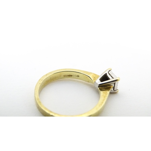 618 - A 9ct gold ring set with central illusion set diamond solitaire. Ring size approx. J