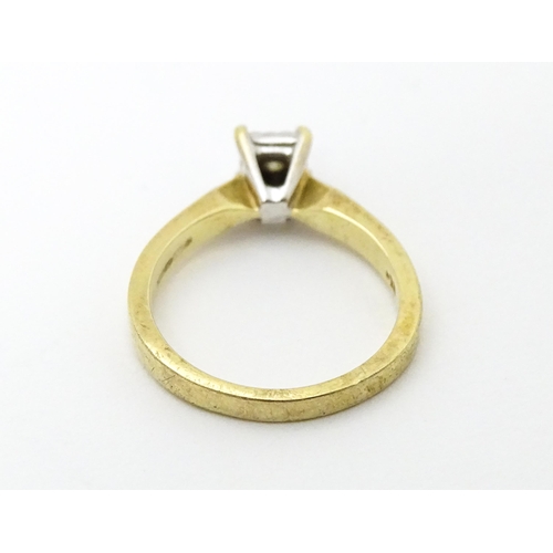 618 - A 9ct gold ring set with central illusion set diamond solitaire. Ring size approx. J