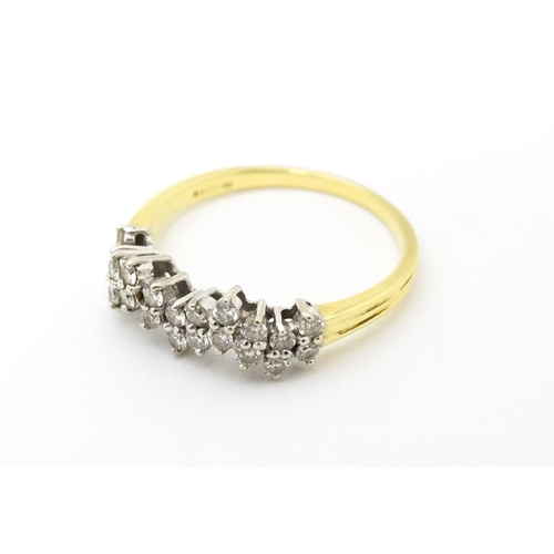 620 - An 18ct gold ring set with a profusion of diamonds. Ring size approx. Q